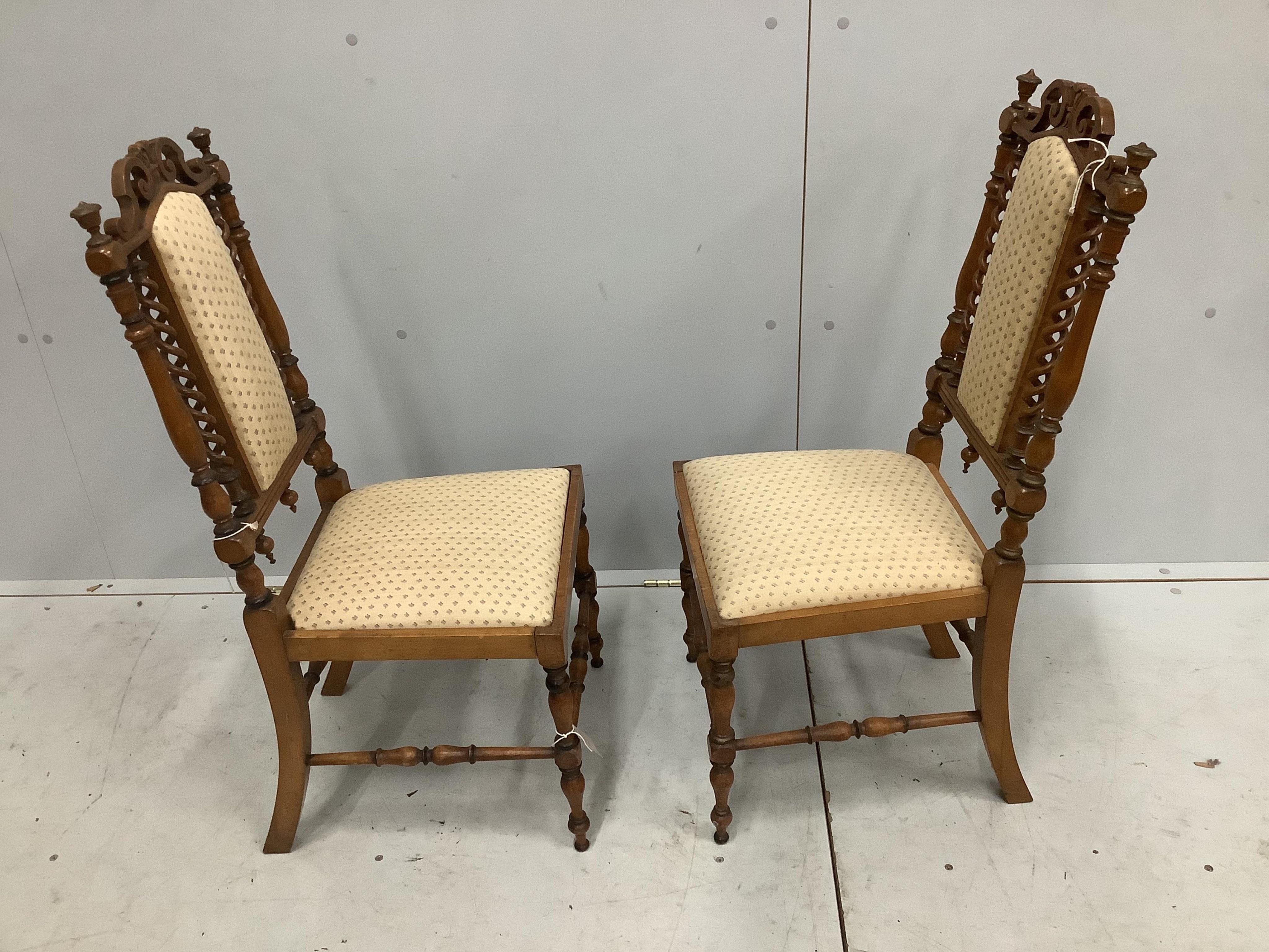 A pair of late Victorian turned mahogany side chairs, width 39cm, depth 36cm, height 86cm. Condition - fair